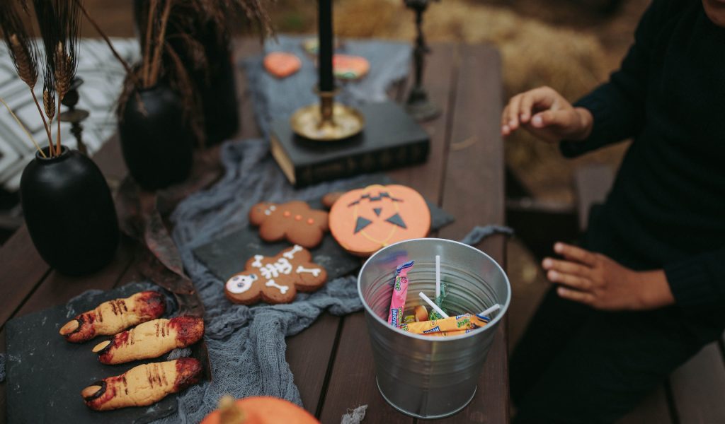 Trick or treat station for backyard halloween party ideas.